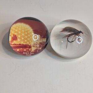 2 Paperweights. One a Fishing Fly the other Ontario Place.